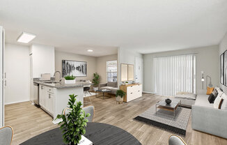 Model Living Room and Kitchen/Dining Room Area with Wood-Style Flooring at Seven Lakes at Carrollwood Apartments in Tampa, FL.