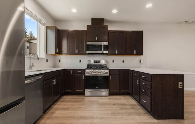 Modern Northshore Townhome with Designer Finishes & 2-Car Garage