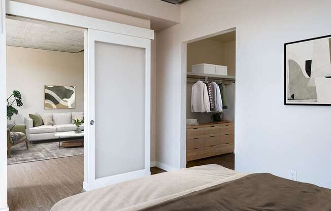 a bedroom with a bed and a closet with a mirror