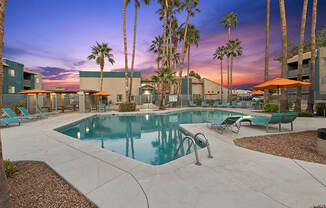 Community Swimming Pool with Pool Furniture at Tanque Verde Apartments located in Tucson, AZ.