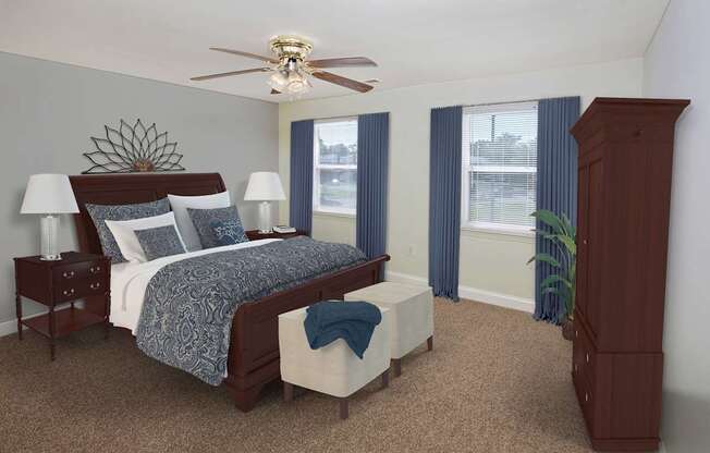 A bedroom with a bed, nightstand, and a ceiling fan.