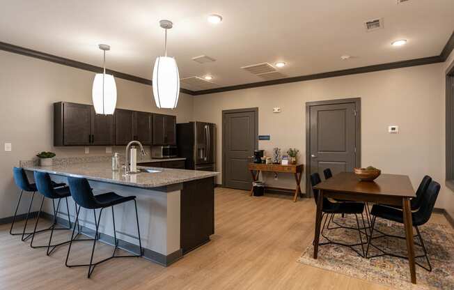 a kitchen and dining area in a clubhouse