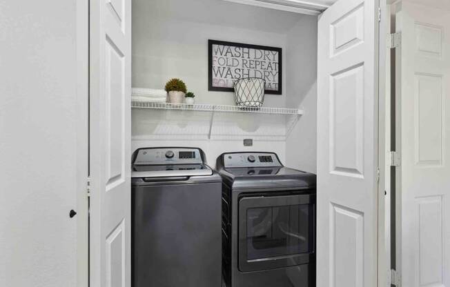 a small laundry room with a washer and dryer