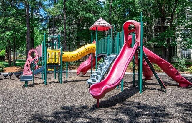 Children have a place to run and play at Autumn Park too! Slides, Climbing Equipment and Racetrack at Autumn Park Apartments, Charlotte, NC 28262