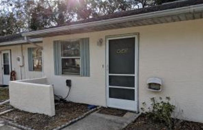 2/2 Flat with Assigned Parking, Screen Porch, Inside Laundry