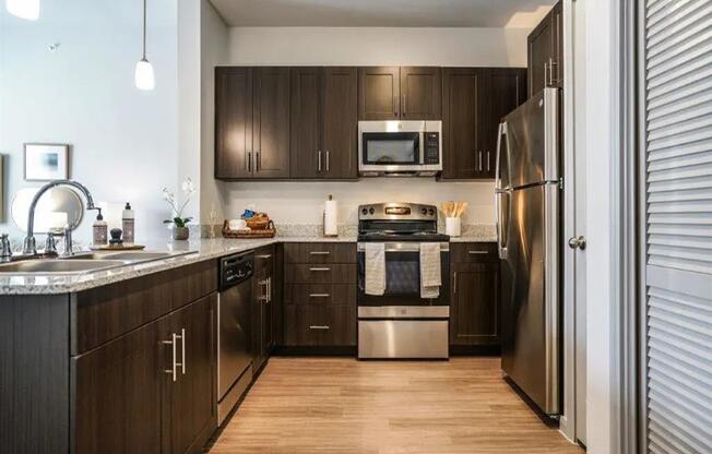 Kitchen with appliances at Emerson at Buda, Buda, 78610