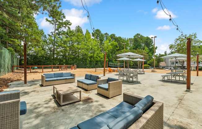 A sunny day at the outdoor seating area with blue cushioned furniture.