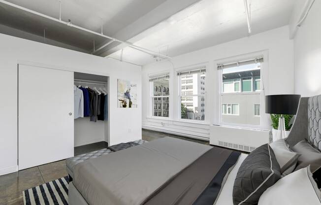 a bedroom with a large bed and a closet