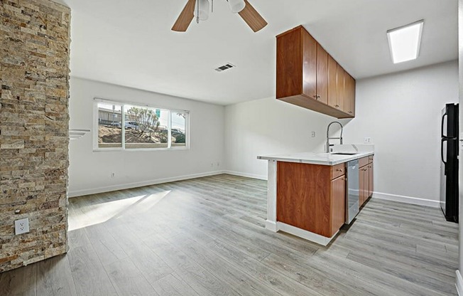 living room and kitchen with vinyl wood like flooring