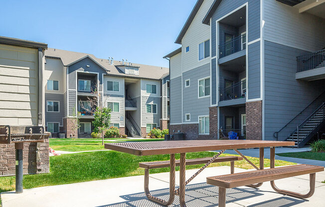 Courtyard With Bbq Area And Lush Gardens at Four Seasons at Southtowne Apartments, Utah, 84095