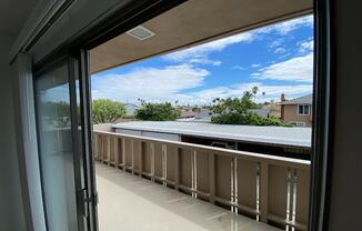 a balcony with a view of a blue sky