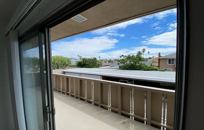 a balcony with a view of a blue sky