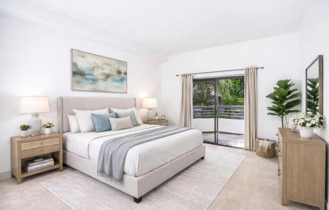 Spacious bedroom with soft finishes, natural light, and select homes with direct access to a private balcony.