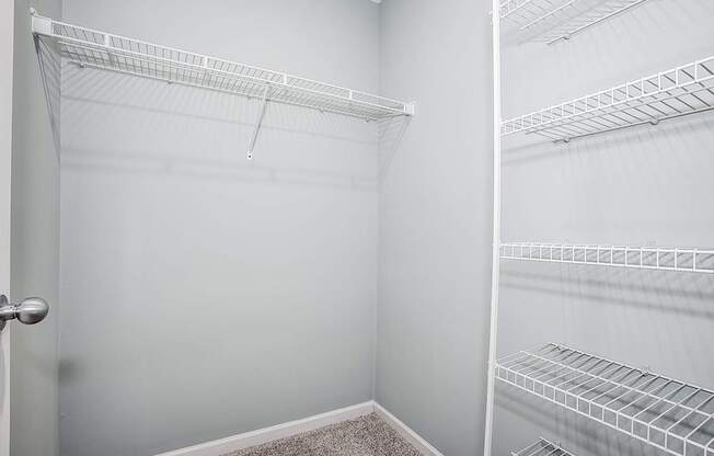 Empty white shelving unit in a room.
