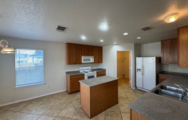 CUTE 2-STORY NESTLED ON A CUL-DE-SAC FEATURING AN ISLAND KITCHEN WITH STOVE/RANGE, DISHWASHER, MICROWAVE & REFRIGERATOR*2 LIVING AREAS W/ TILED FLOORING DOWN & LAMINATE UP*CEILING FANS*MASTER BATH HAS SEPARATE SHOWER & GARDEN TUB*WALK-IN CLOSET*COVERED PA