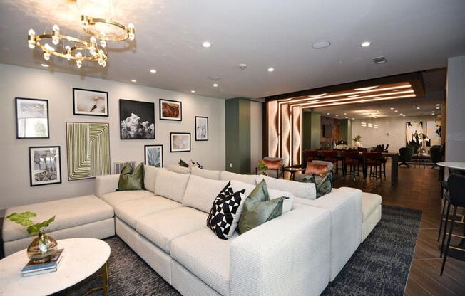 a large living room with a white couch and a table