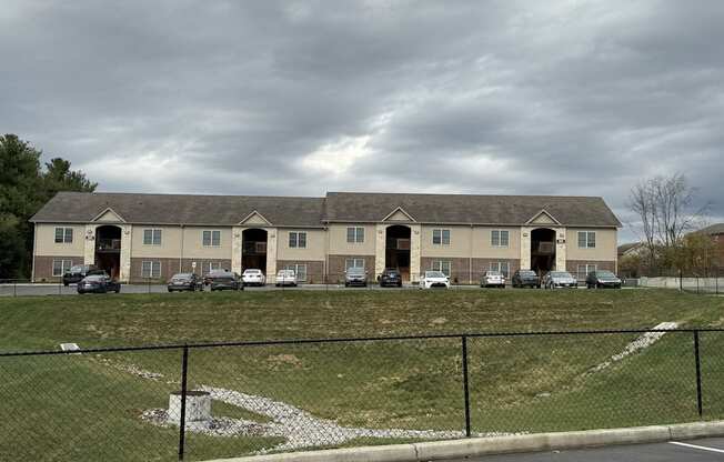 a large building with cars parked in front of it