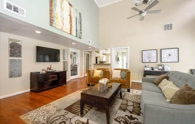 a living room filled with furniture and a ceiling fan at Sagewood Gardens Senior Apartments, California, 91745