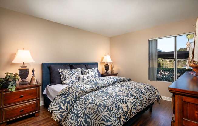 Bedroom with a large bed and a window