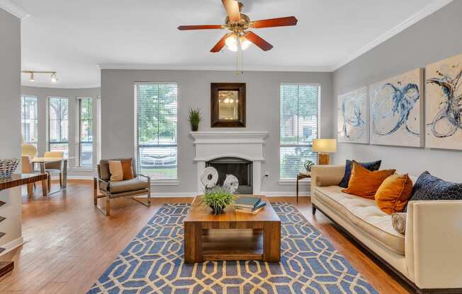 a living room with a couch and a coffee table and a fireplace