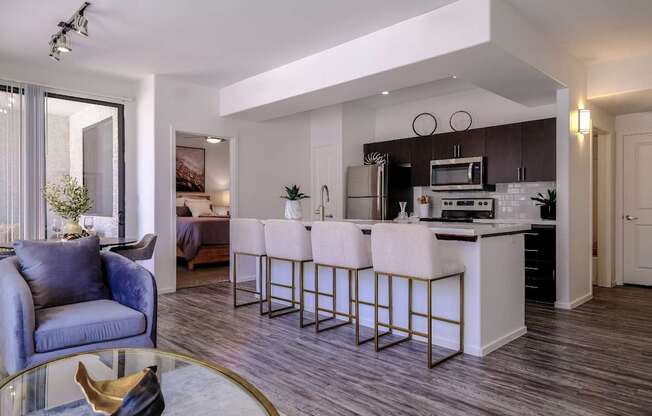 spacious, open-concept kitchen and living room at Avora apartments