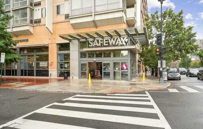 Safeway store front with a crosswalk in front.