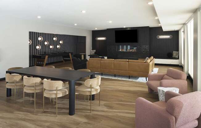 A modern living room with a black table and chairs.