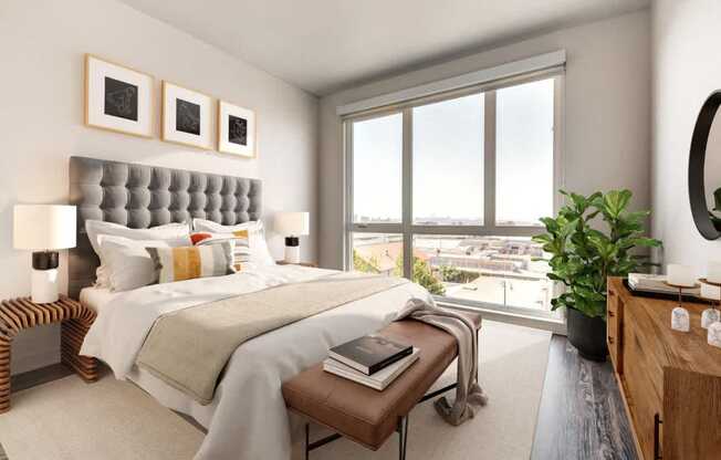 A bedroom with a large bed and a view of the city.