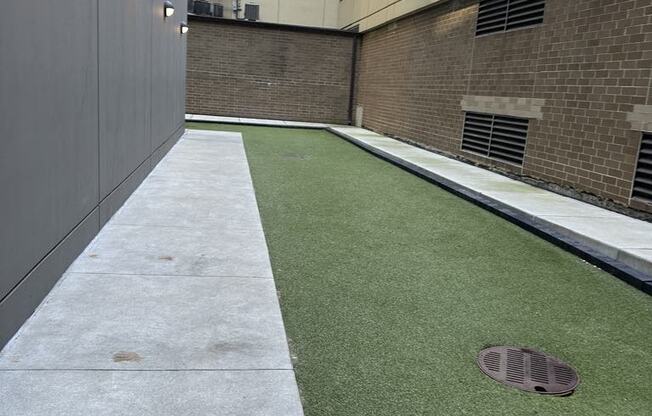 an artificial lawn on the side of a building