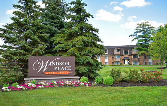 the sign in front of the windsor place apartments