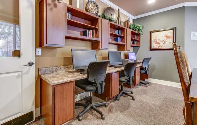 Business Center with three computers and working desk