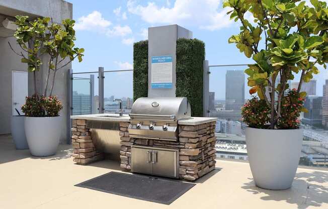 Grill out with endless city views on top of our Sky Deck rooftop amenity.