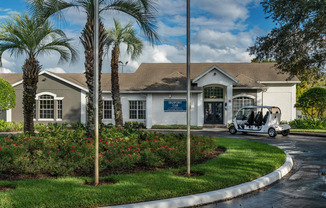 the front of a building with a golf cart in front of it