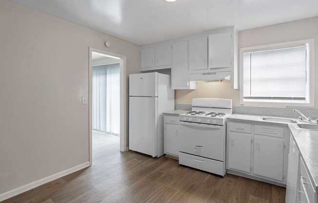 the preserve at ballantyne commons apartment kitchen with white appliances and white cabinets