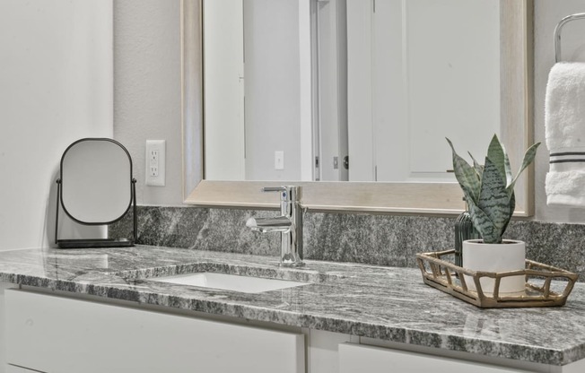 Bathroom With Mirror and a sink at The Edison at Chapel Hills, Colorado Springs, CO, Colorado