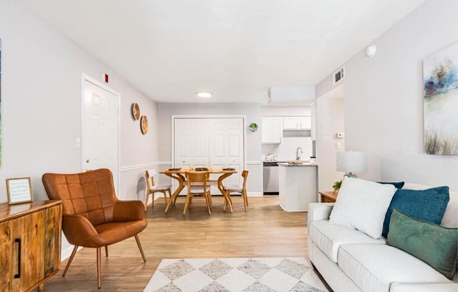 a living room with a couch and a dining table