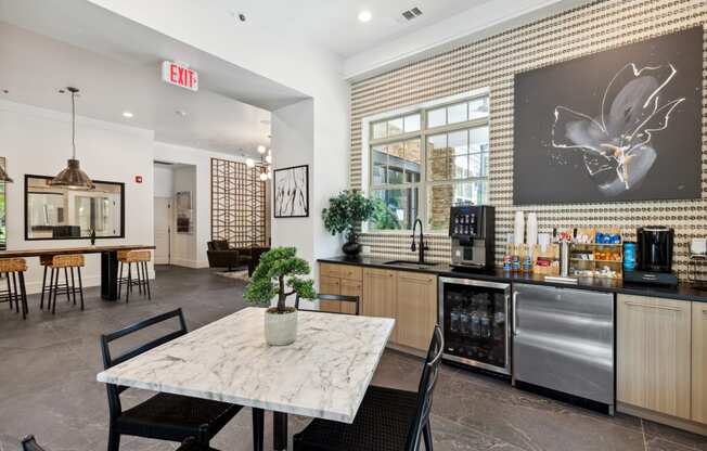 a kitchen and dining area with a table and chairs