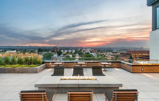 Rooftop fire pit lounge with sweeping mountain views and a front-row seat to Denver sunsets.