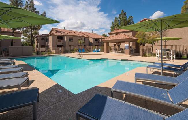 Outdoor pool with lounge chairs