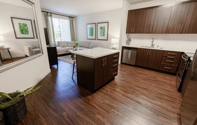 a view of a kitchen and living room in an apartment