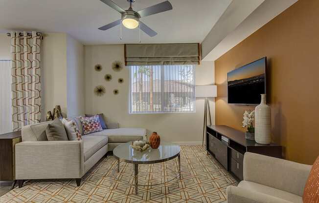 Living with couch and center table , ceiling fan and light at The View at Horizon Ridge, Nevada