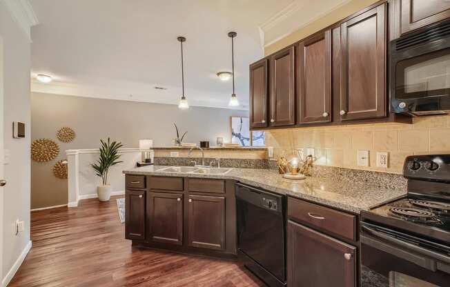 a kitchen with wooden cabinets and a counter top