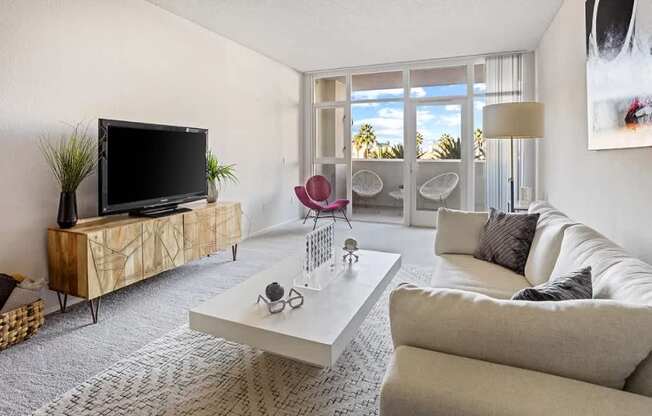 Living Room With TV at Towers at Costa Verde Apartments, San Diego, 92122