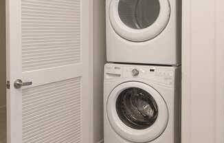 a small laundry room with a washing machine and a dryer