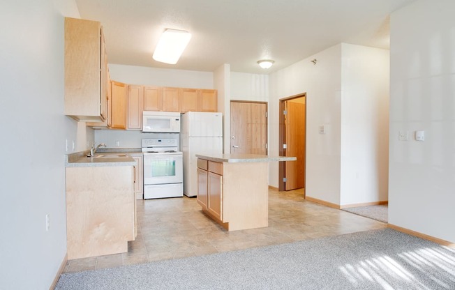 Kitchen with white appliances at Lakestone Apartments, Moorhead, MN