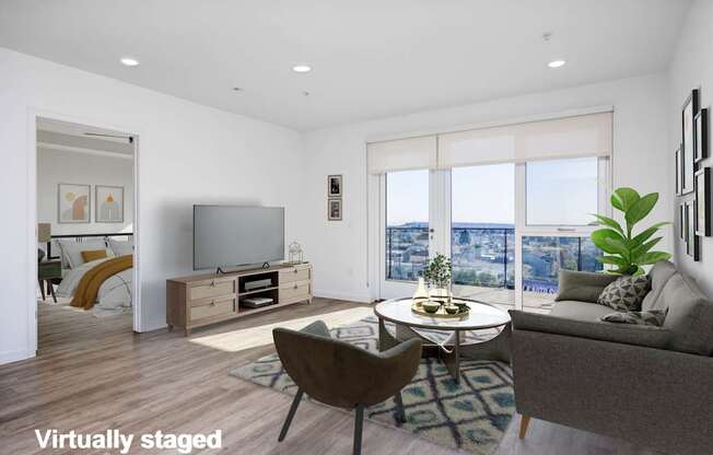 A modern living room with a large window and a view of the city.