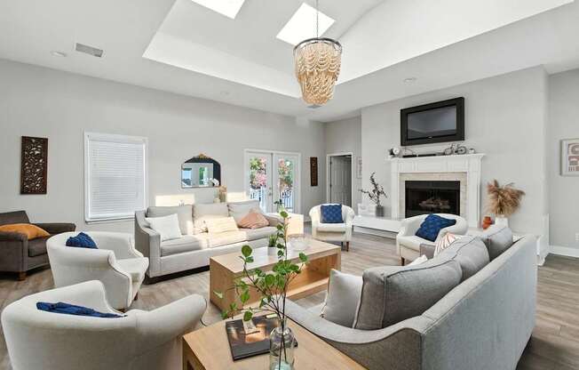 A living room with a fireplace and a television.