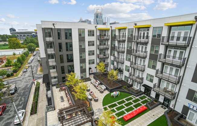 an aerial view of an apartment complex with a green courtyard at Link Apartments® Mint Street, Charlotte, NC, 28203