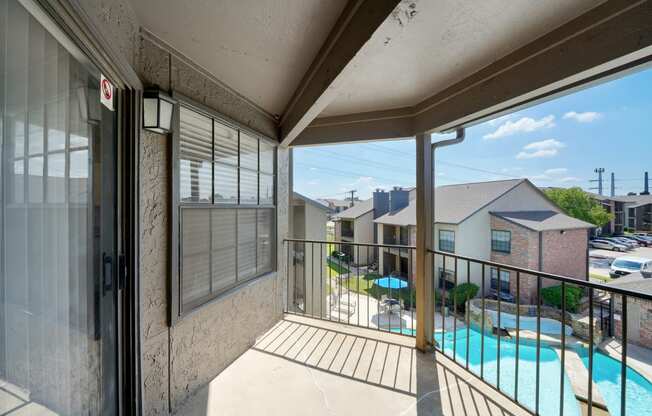 Balcony with Pool View at Polaris Apartment Homes in Irving, Texas, TX