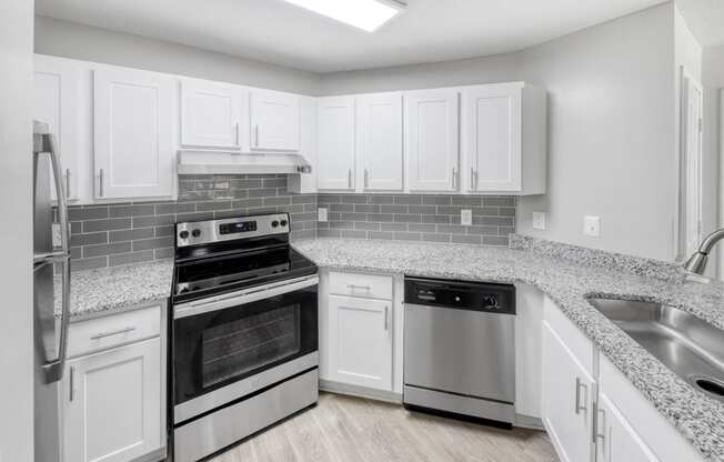 Modern Kitchen with Stainless-Steel Appliances and backsplash located at Twenty35 Timothy Woods in Athens, GA 30606